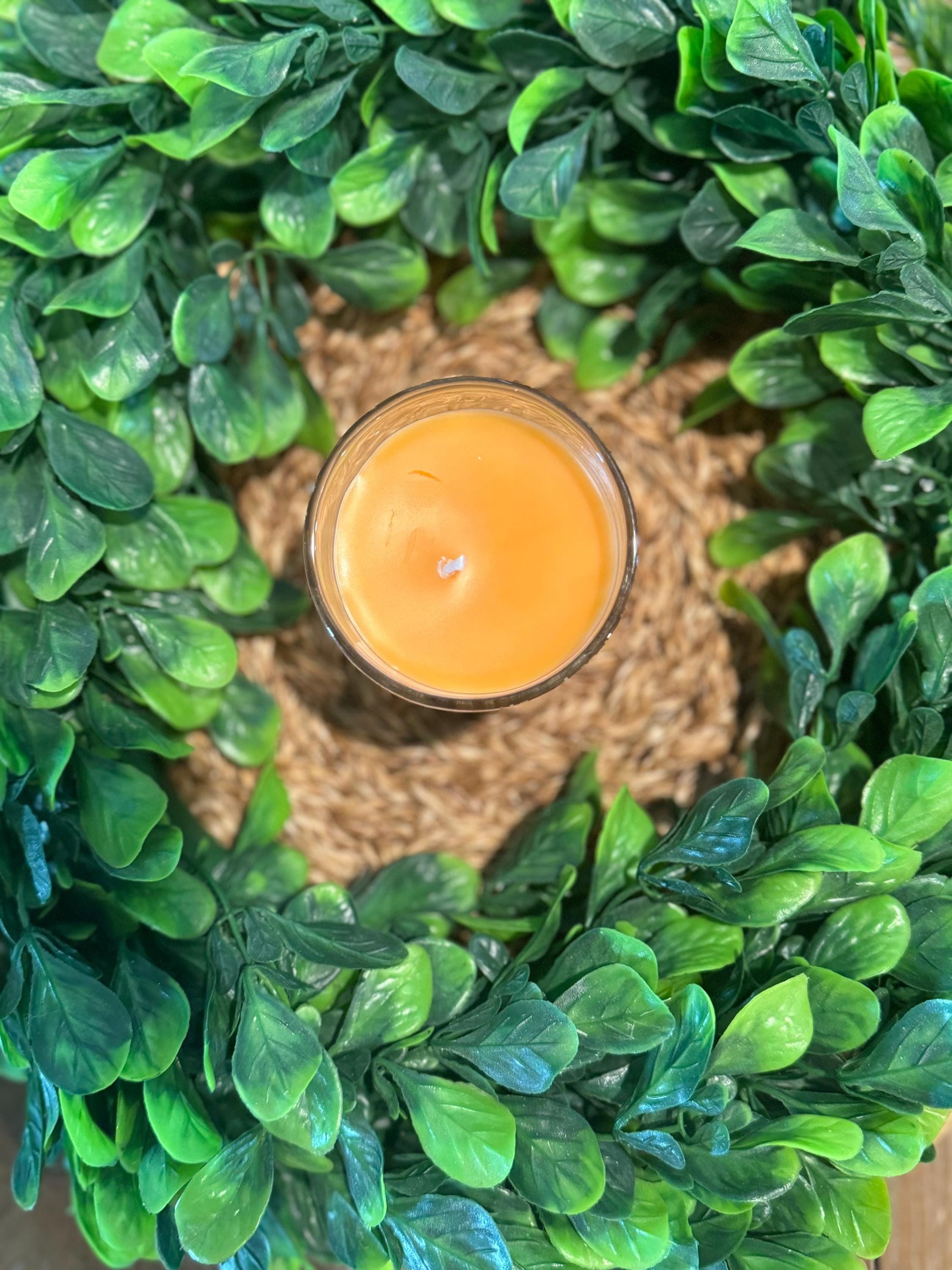 a candle sitting on top of a wreath